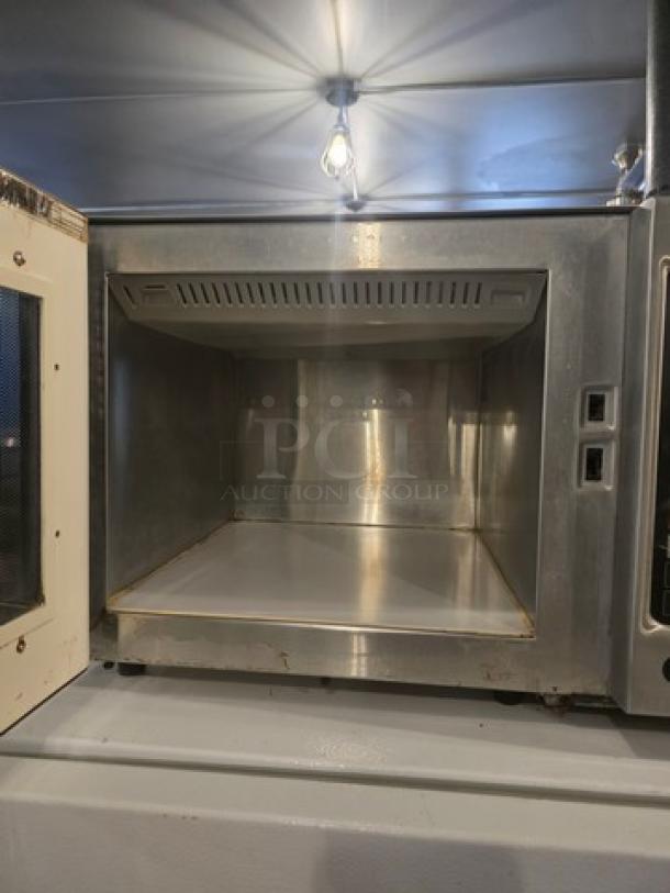 Amana Menumaster Commercial Microwave Oven, Model RFS10SW2, stainless steel, open door view, spacious interior, good condition.