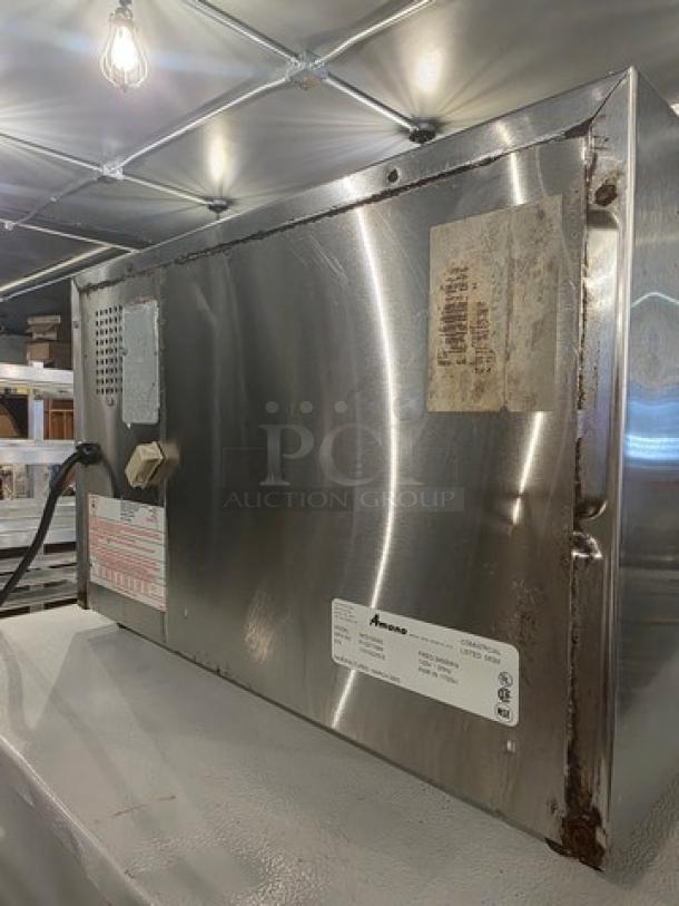 Amana Menumaster Commercial Microwave Oven RFS10SW2, stainless steel, visible wear, model and safety labels intact.
