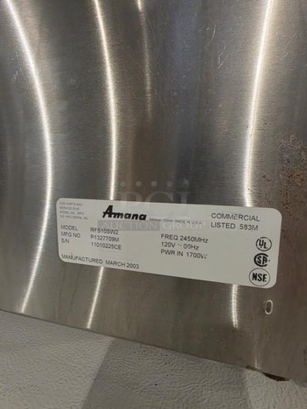 Amana Menumaster Commercial Microwave Oven, model RFS10SW2. Label indicates 120V, 1700W, manufactured March 2003.