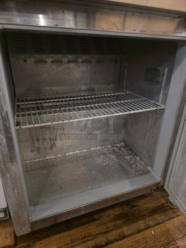 Continental 27" SW27 commercial undercounter refrigerator, stainless steel interior, one wire shelf, used condition.