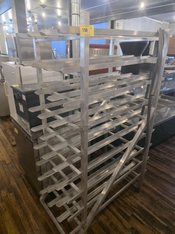 Aluminum can rack with multiple shelves, in good condition, ideal for storage or display, item number 158 on top.