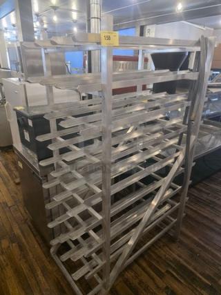 Aluminum can rack with multiple shelves, in good condition, ideal for storage or display, item number 158 on top.