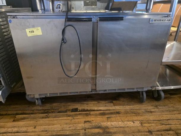 Beverage-Air UCR48A 48" undercounter refrigerator, stainless steel, dual doors, visible wear, label "159", on wheels.