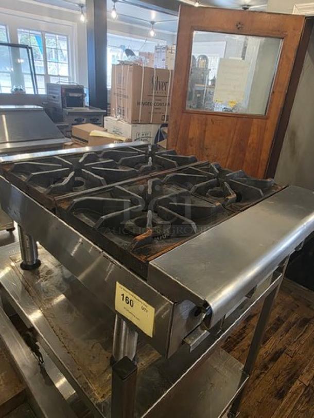 Imperial 4 burner countertop range, natural gas, stainless steel, used condition, stand not included, model tag visible.