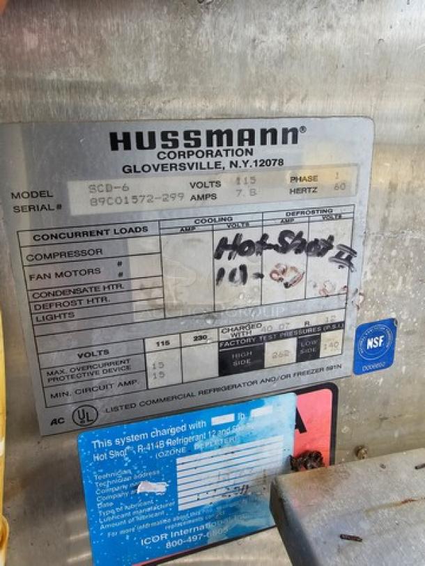 Hussmann SCD-6 Refrigerated Display Case, model SCD-6, serial number 99C01572-299, features NSF label.