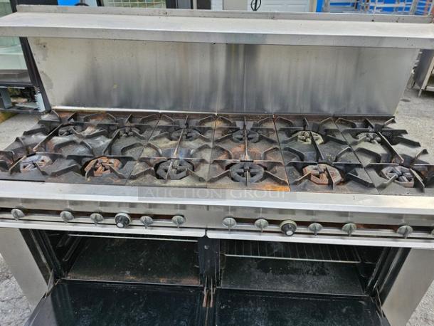 Dynamic Cooking Systems 72-12-2 natural gas range, 12 burners, dual oven bases, stainless steel, used condition, visible wear.