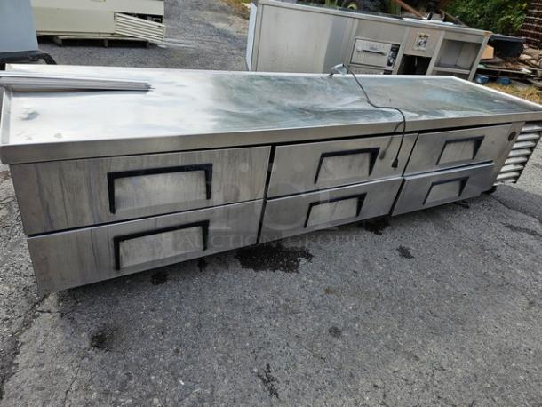 True TRCB-110 six-drawer refrigerated chef base, 110", stainless steel, used condition, visible surface wear.