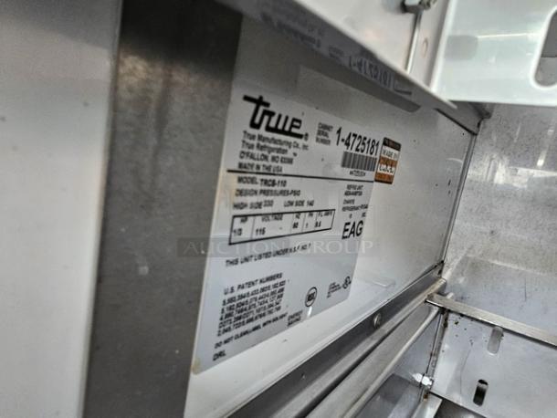 True TRCB-110 six-drawer refrigerated chef base, 110". Durable stainless steel. Visible model and pressure labels.