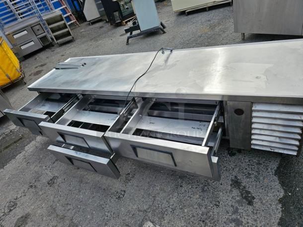 True TRCB-110 six-drawer refrigerated chef base, 110", stainless steel, good condition, visible drawers open, ideal for kitchens.