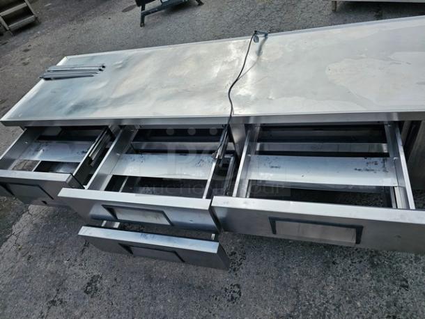 True TRCB-110 six-drawer refrigerated chef base, 110" stainless steel, open drawers, good condition.
