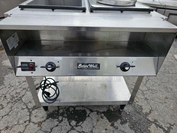Vollrath 38116 ServeWell electric hot food table, two pan, stainless steel, 208/240V, with control knobs and power cord.