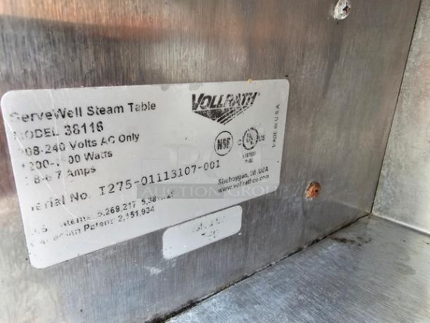 Vollrath 38116 ServeWell Electric Two Pan Hot Food Table label, showing model, voltage, wattage, and serial number details.