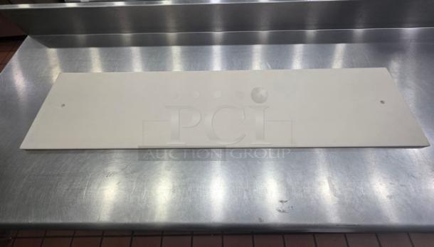 Lot of 3 cutting boards, longest is 67". Visible board is white, rectangular, with slight wear, on a stainless steel surface.