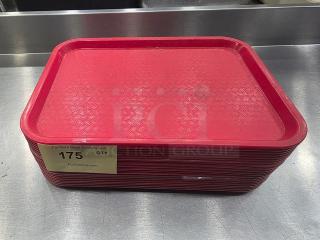 Lot of 23 red plastic serving trays, textured surface, used condition. Auction label "175" visible, stackable design.