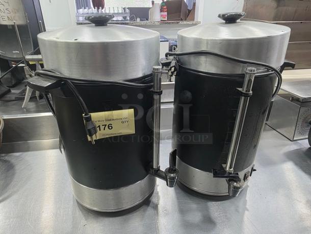 Lot of two Regal Ware 58101R aluminum percolator coffee urns. Black body, silver lid, plug-in type. Marked as unit "176".