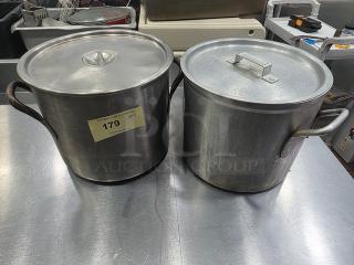 Lot of two stock pots with lids, metal construction, handles on sides. Visible wear. Label marked "179 QTY 2".