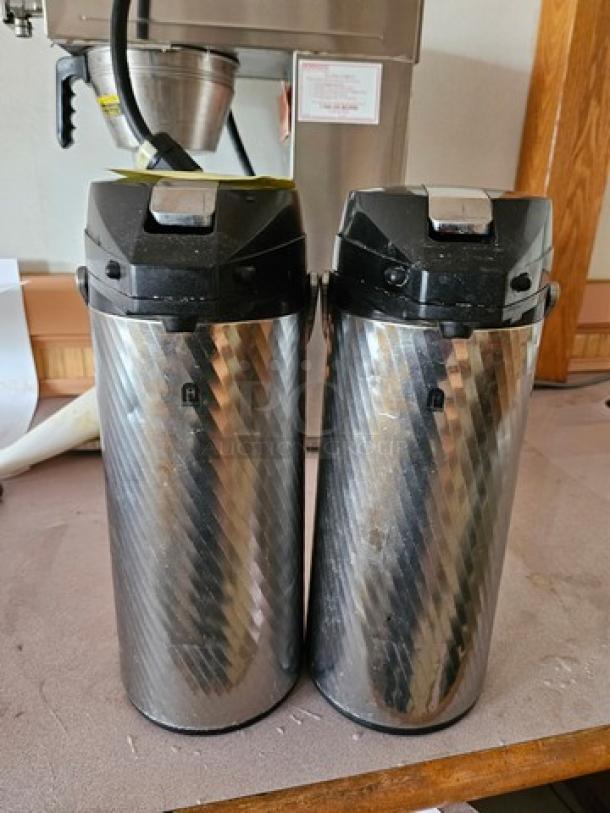 Lot of two Newco Thermal Airpots, stainless steel finish, advanced locking lids, excellent condition.
