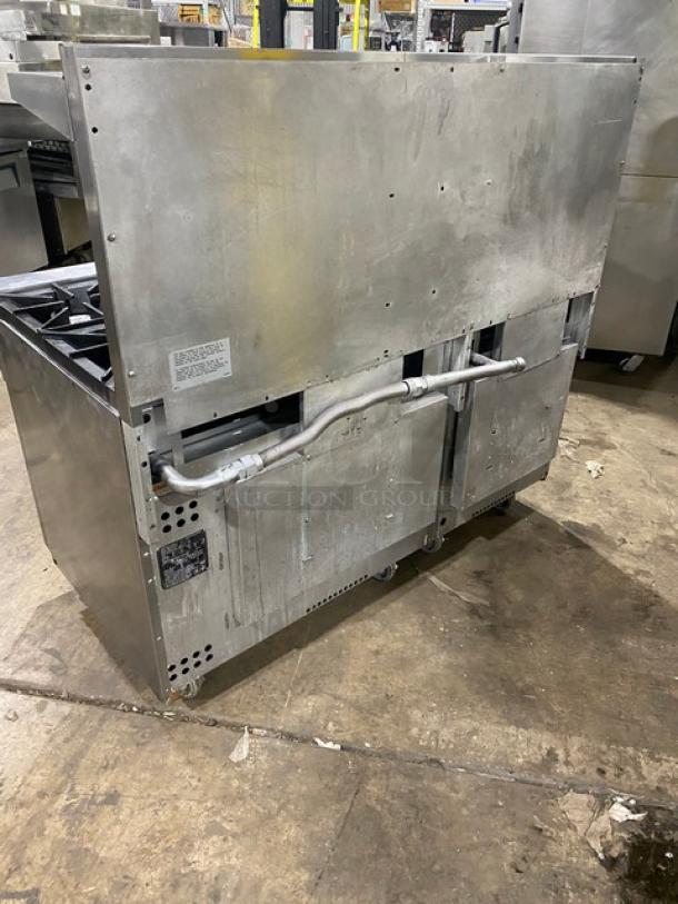 Vulcan 10-burner range/double oven combo, stainless steel, model 60SS-10BN, with backsplash, salamander shelf, on casters.