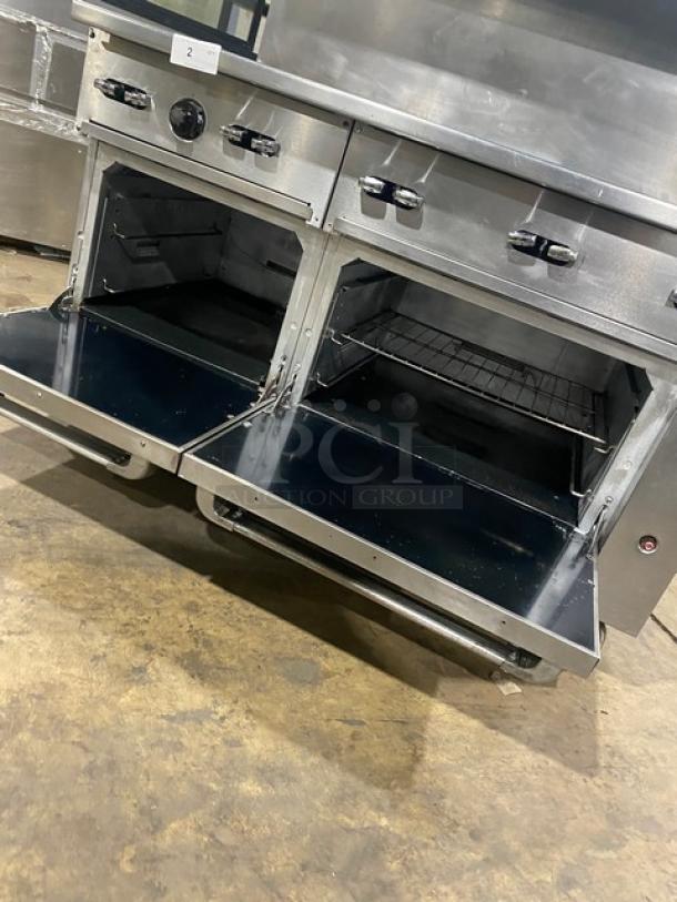 Vulcan 60SS-10BN 10-burner range/double oven; stainless steel; natural gas; with backsplash, overhead salamander shelf, wired oven rack; on casters; excellent condition.
