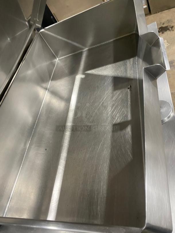 Commercial stainless steel electric tilted braising pan with swivel faucet, on legs. Excellent condition, polished finish.