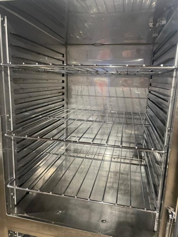 Alto-Shaam 1200-UP/SR heated cabinet interior, stainless steel, chrome wire racks, spacious design, excellent condition.