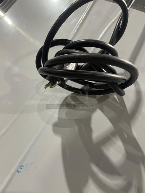 Coiled power cord for Alto-Shaam Halo Heat Series, model 1200UPSR, visible voltage markings, black color.