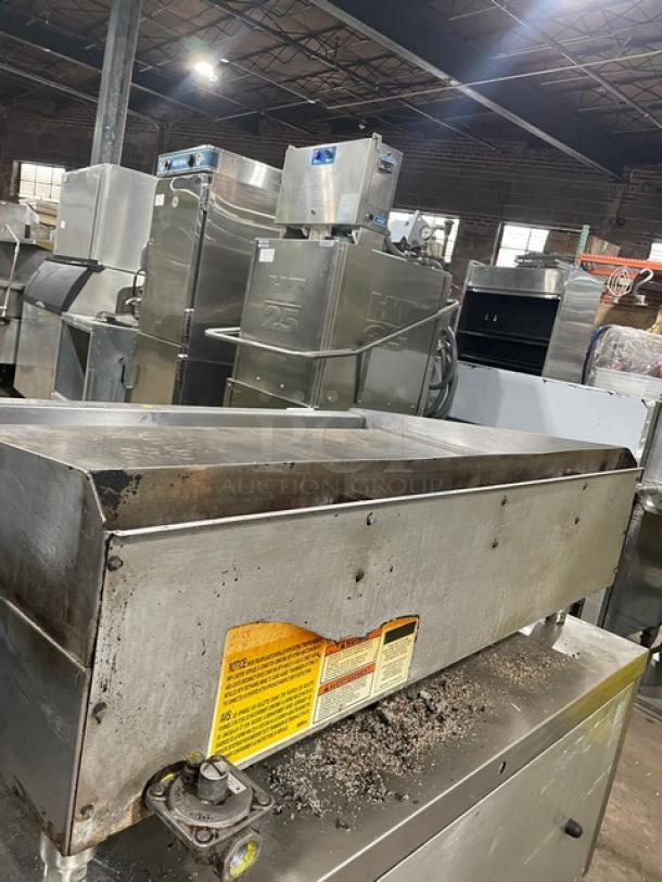 Wolf commercial stainless steel countertop flat griddle, natural gas, back and side splash, on legs, used condition.