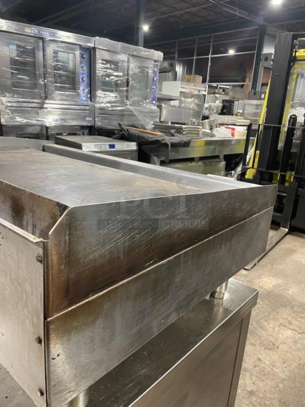 Wolf commercial stainless steel natural gas countertop flat griddle with back and side splash, on legs. Good condition.
