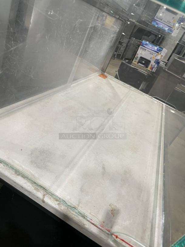 Structural Concepts commercial refrigerated display case, Starbucks style, multi-level, black, enclosed-glass top, on legs, used.