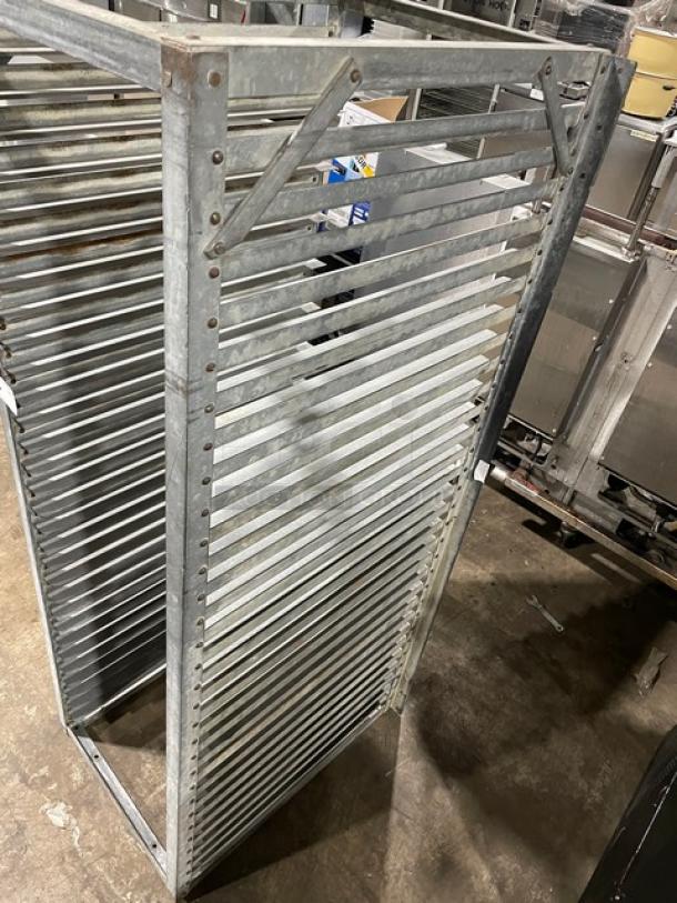 Commercial heavy-duty pan holding rack made of stainless steel, multi-tiered shelves, robust construction. Ideal for kitchens.