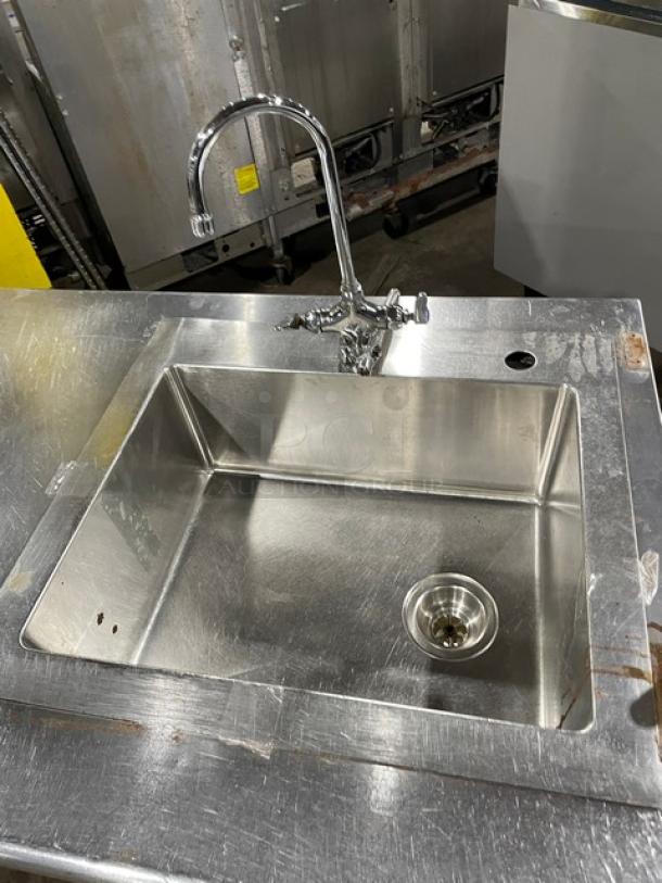 Commercial stainless steel single-compartment sink with gooseneck swivel faucet, undershelf, on legs; used condition.