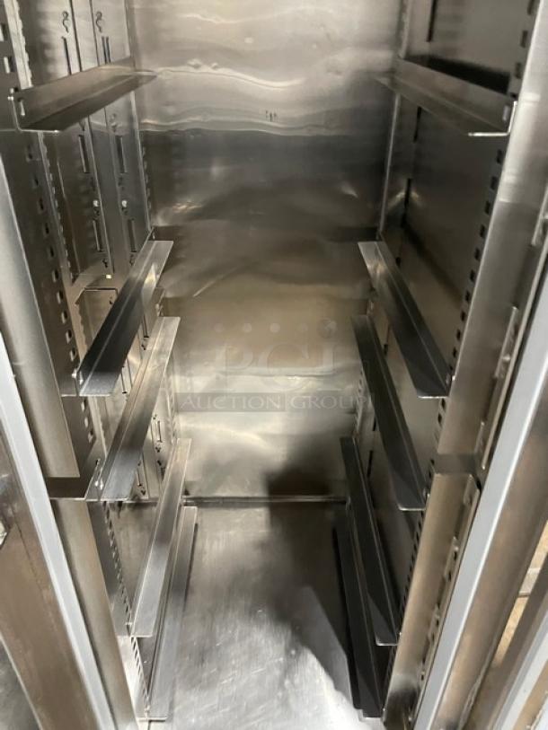 Victory RS2DS7 stainless steel 2-door commercial refrigerator interior with pan slides, on legs, model SN: J0978460.