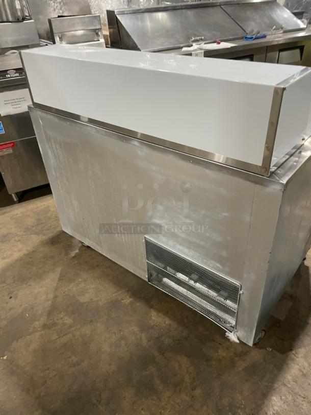 CoolTech CMPH48BMO stainless steel 2-door refrigerated prep table, 2018 model, on casters with chrome wire rack.