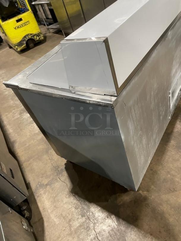 CoolTech 2018 stainless steel 2-door refrigerated prep table, model CMPH48BMO, with chrome rack, on casters.