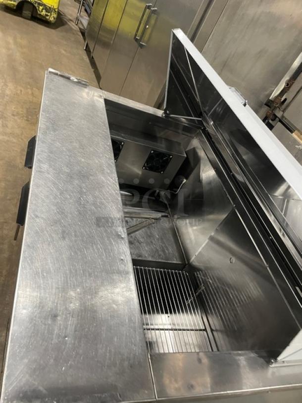 CoolTech 2018 stainless steel 2-door refrigerated prep table, model CMPH-48BMO, chrome wire rack, on casters.