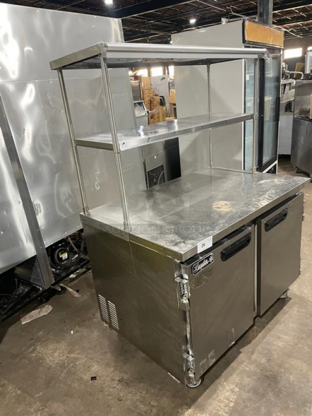 Leader ESLB48SC Stainless Steel 2-Door Lowboy Worktop Refrigerator with double overhead shelf, receipt holder, on casters.