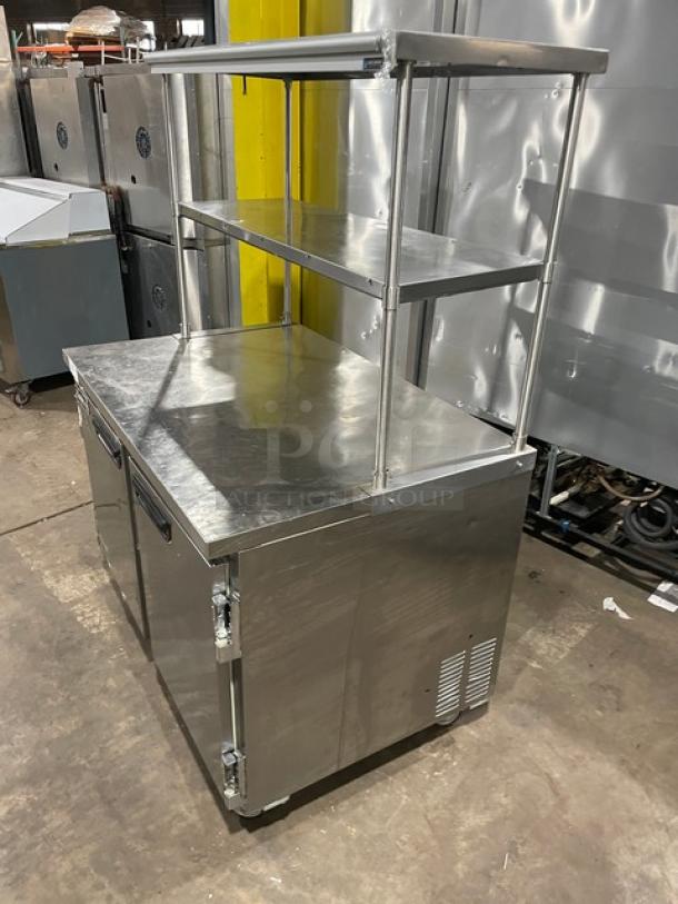 Leader ESLB48SC stainless steel 2-door lowboy worktop refrigerator, double overhead shelf, casters, 115V 1 Phase.