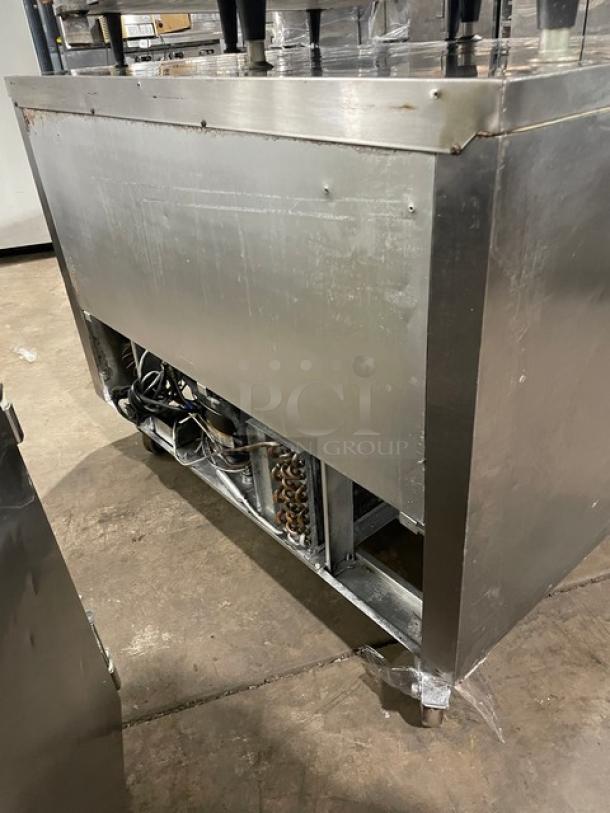 Leader NSFB48SC Stainless Steel 2 Door Undercounter Refrigerator, poly coated wire rack, 115V 1-phase, on casters, visible wear.