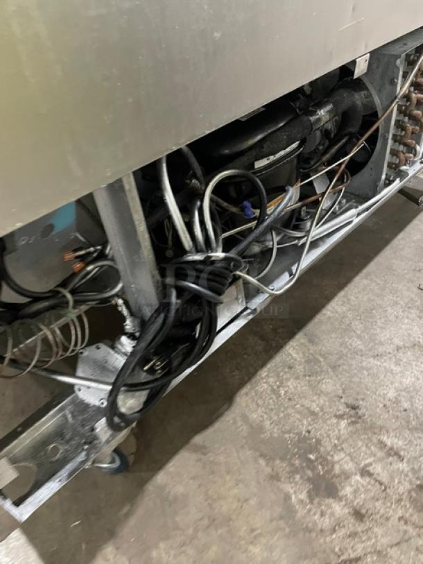 Leader Commercial Stainless Steel 2 Door Refrigerator, Model NSFB48SC, poly coated rack, 115V, on casters, underside wiring visible.