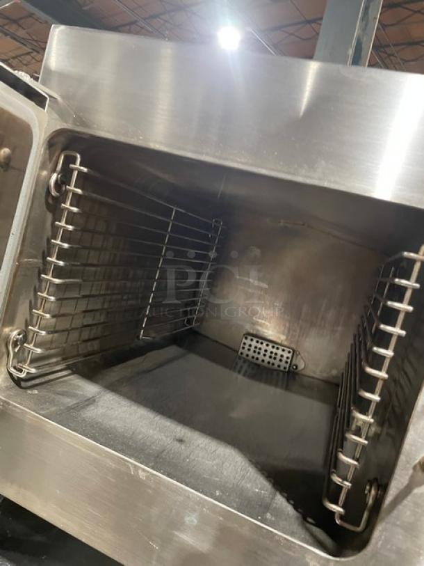 Cleveland Range 21CET8 stainless steel 3-pan convection steamer with built-in pan rack, 208V, 3 phase, on legs, interior view.