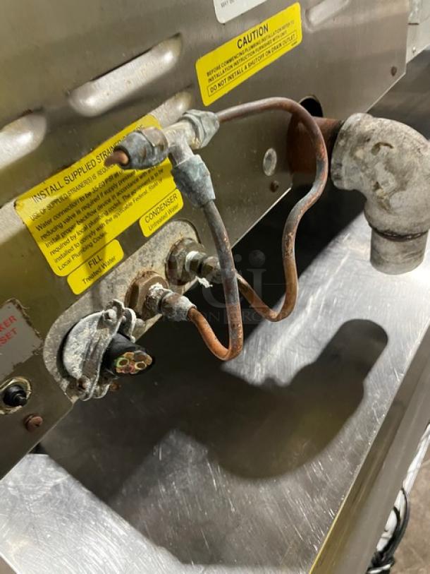 Cleveland Range 21CET8 convection steamer back view showing electrical components and caution labels, used condition.