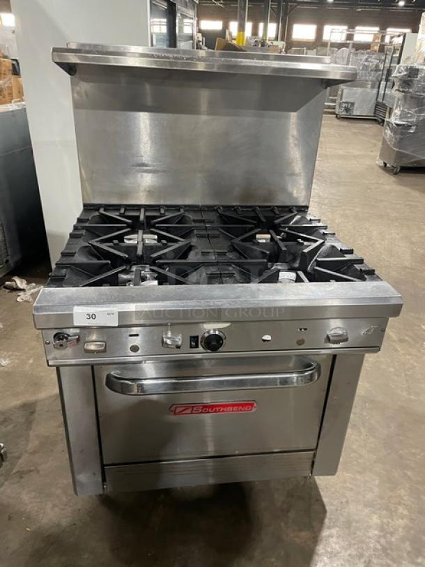 Southbend stainless steel 4-burner range/oven combo, model 4367D, with backsplash, overhead salamander shelf, and wired rack.