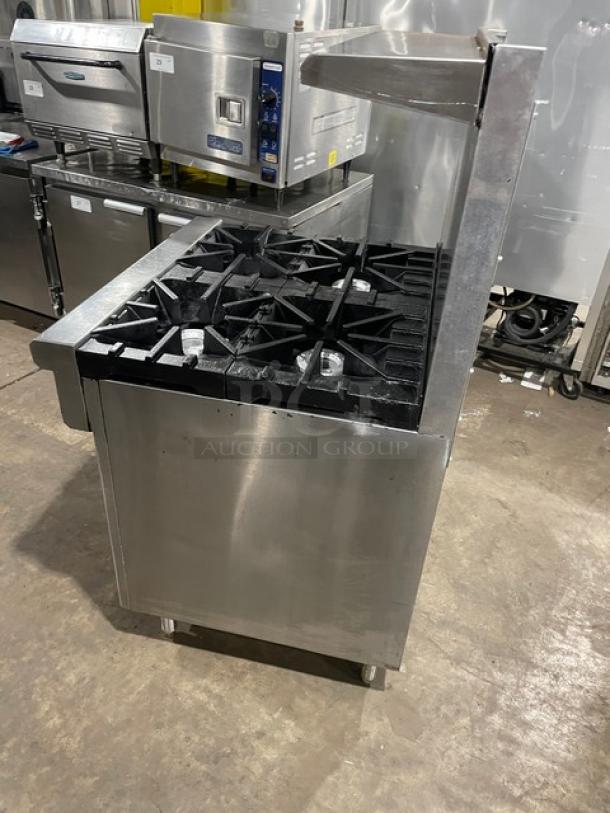Southbend 4367D commercial stainless steel 4-burner range/oven combo with backsplash, overhead salamander shelf, and wired oven rack.