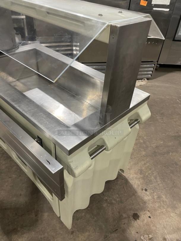 Custom stainless steel portable refrigerated salad bar with sneeze guard, folding tray slide, and casters.