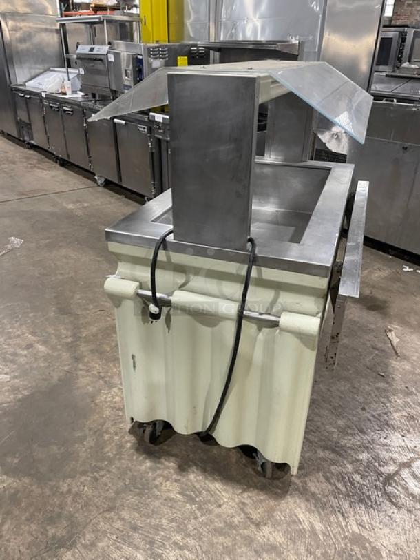 Custom buffet style stainless steel refrigerated cold food bar with sneeze guard, folding tray slide, and casters.