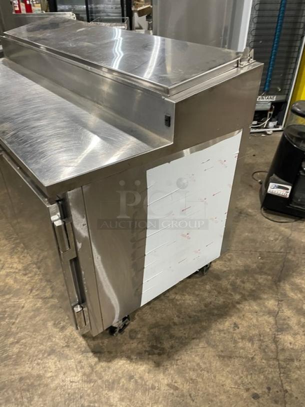 Marsal BM72R stainless steel 3-door refrigerated pizza prep table, 72", with pan slides, shelving, on casters. Model BM72R SN: 1961.