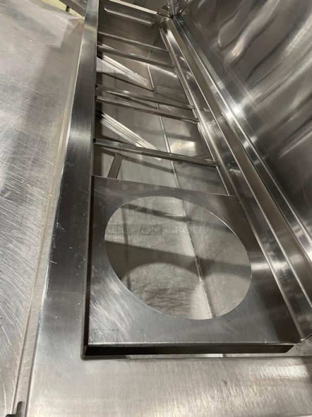 Marsal BM72R stainless steel 3-door refrigerated pizza prep table with built-in pan slides, 72" wide, on casters, no compressor.