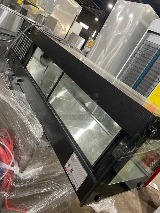Turbo Air black refrigerated countertop sushi merchandiser with stainless steel interior, rear sliding doors, SN: H2SAS50D1024.