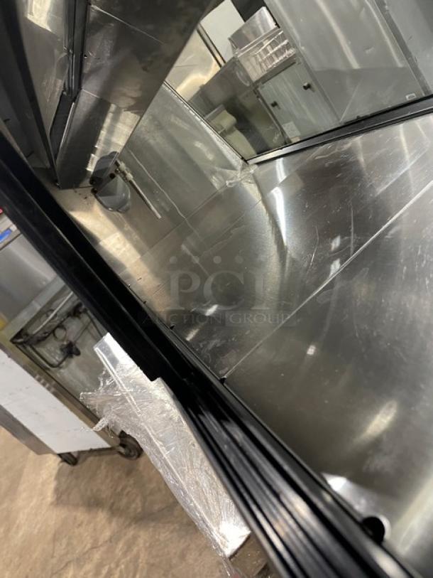 Turbo Air black refrigerated countertop sushi merchandiser with stainless steel interior and rear sliding doors.