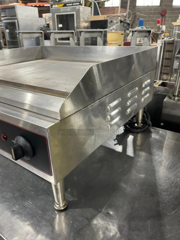 Cecilware EL1624 stainless steel electric countertop 24" flat griddle, thermostatic control, back and side splash, on legs.